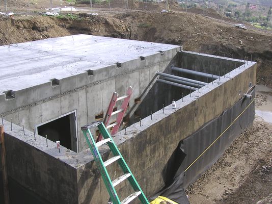 Looking at the entry area.
Here's a good look at the entry area and the conduits extending from the transmitter building to what will be underground when the earth is pushed back around the building.
Keywords: KMLT