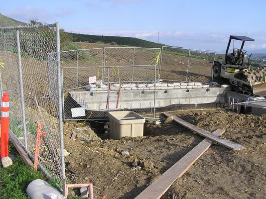 KMLT Almost Buried
If you compare this photo with past photos you'll notice that half the transmitter building is now buried.  When complete only the ground level access in the foreground of the building will remain.  The pullbox to the left of  center is for electrical power.  The pullbox to the far right is for the coaxial egress point to feed the antenna.
Keywords: kmlt almost buried