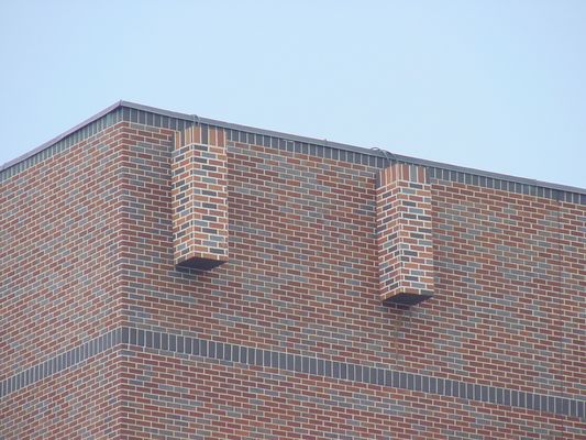 Disguised as part of the brickwork
This antenna array is cleverly painted to match the color and texture of the building.  Downtown LA intersection, yet barely noticeable.
Keywords: disguise camouflage cellular wireless hidden fascia